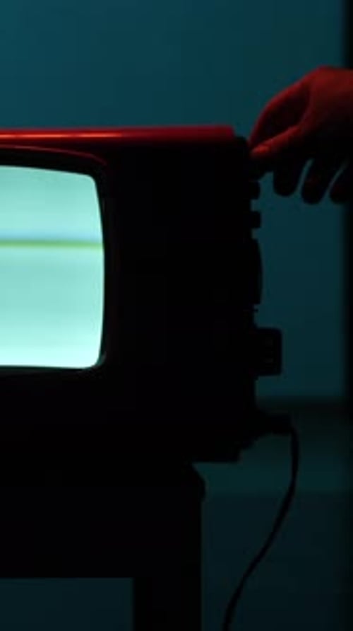 Turning on a Vintage Television Set in the Dark