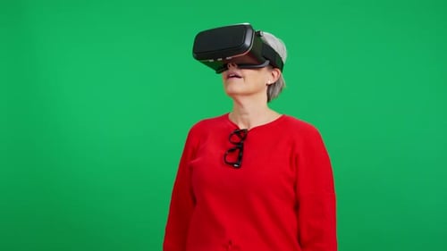 Woman Wearing VR Headset Gesturing on Green Screen