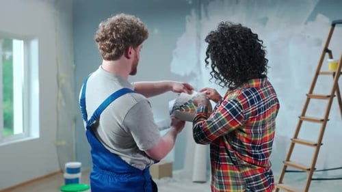 Couple Choosing Paint Colors in Home