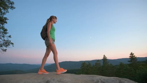 Young Woman Hiking Alone on Mountain Footpath Female Hiker Enjoying View of Evening Nature on
