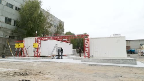Timelapse Workers Build Electrical Substation Premises Against Cloudy Sky