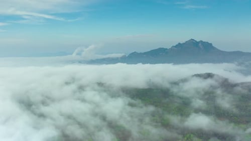 Aerial view morning scenery Mist flowing over the high mountains.