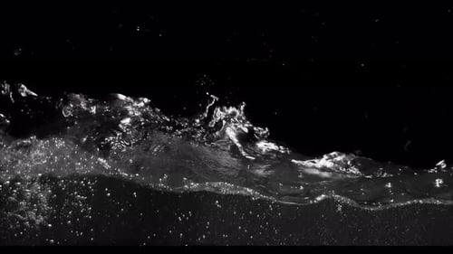 Submerge Collection: Waves of water drifting slowly from the left side over a black background