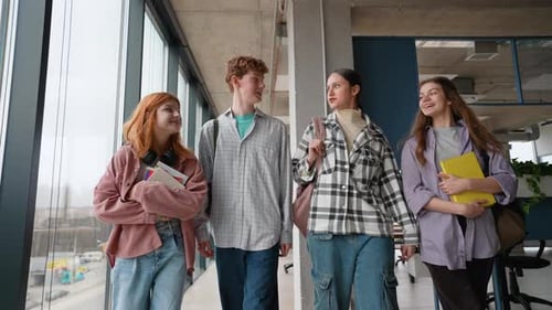 Happy Group of Students Walking in School