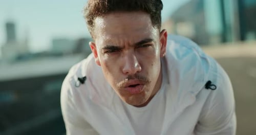 Sweaty Man Catching Breath After Exercise in City