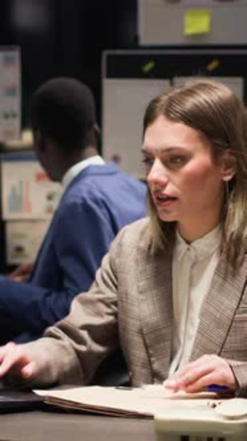 Professional Woman Working at Her Desk in the Office