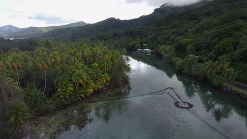 Ancient stone fish trap in tropical tidal lagoon in French Polynesia