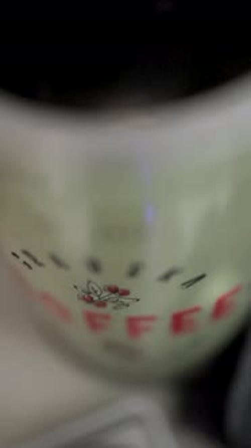measuring 18 grams of coffee on a scale