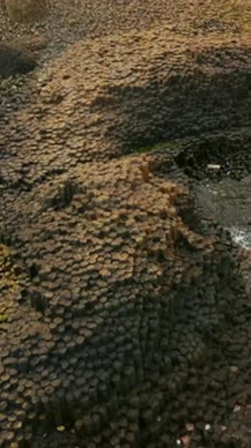 Clockwise overhead social ratio aerial video of The Giant's Causeway in Bushmills, Northern Ireland