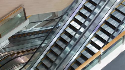 POV to the escalator in department store/international airport without people