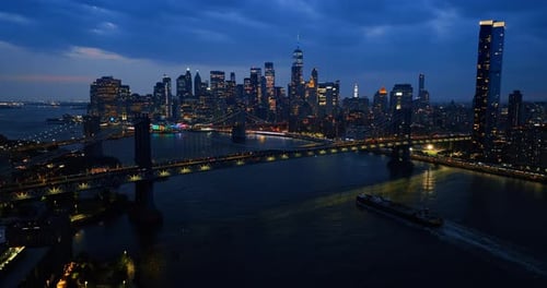 East River, bridges and skyscraper skyline of New York. City view at night.