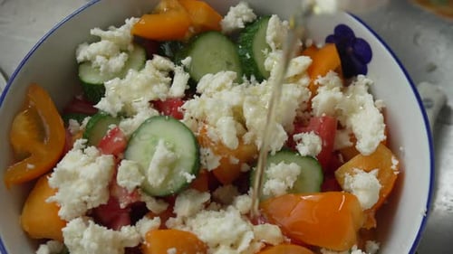 Salad Pouring Oil Over Fresh Cucumber Tomato Cheese Healthy Meal