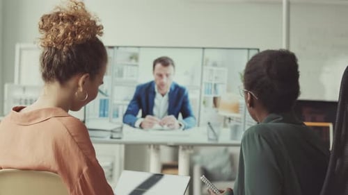 Adults in Office Attending Video Meeting