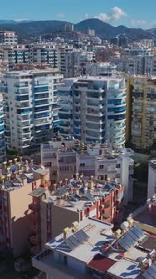 Vertical Video of Residential Construction in Progress With Metal Structures and Wall Building By