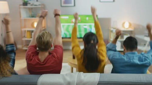 Friends Cheer While Watching Sports on TV