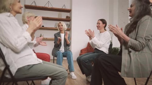 Women Applaud in a Group Therapy Session