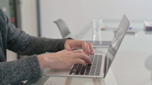 Close up of Hands Typing on Laptop