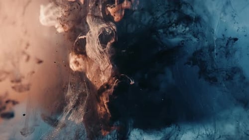 Exploding paint ink underwater in red and blue colors,close up slow motion