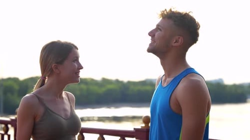 Close Up of Joyful Caucasian Sporty People Chatting and Laughing Outdoors After Workout