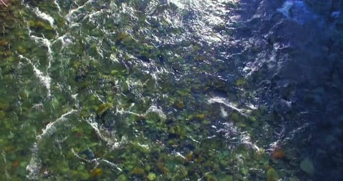 Low Altitude Flight Over Fresh Fast Mountain River with Rocks at Sunny Summer Morning