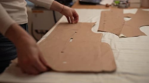 Person Working with Pattern in Studio