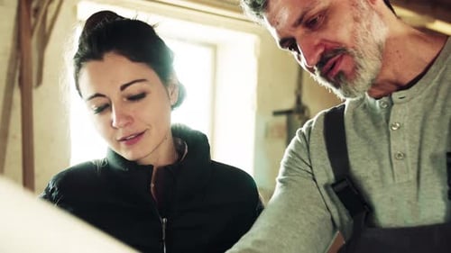 Man and Woman Workers in the Carpentry Workshop., Planning