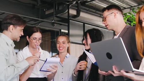 Diverse Team Collaborating on a Project in Office