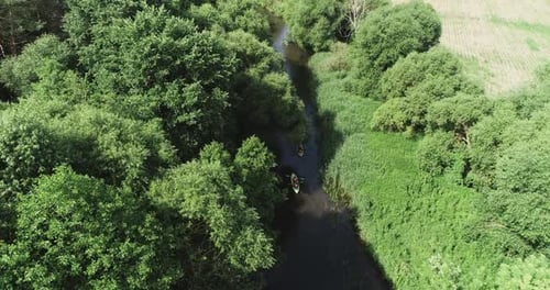 Rafting on the River Kayaking View From a Height Team of Explorers Floating on a River in a Forest
