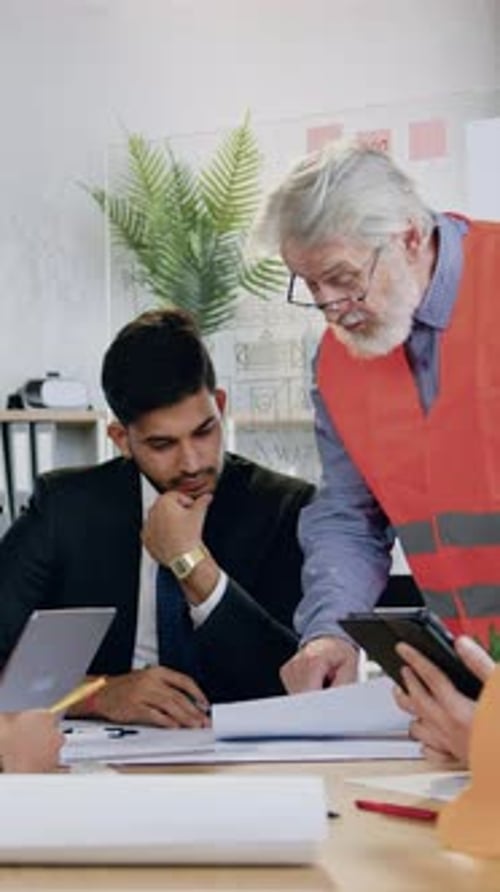 Construction Industry Concept Where Confident Respected Greybearded Mature Architect Clarificating