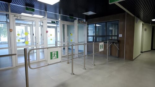Entrance Features Metallic Turnstiles and Glass Exit Doors