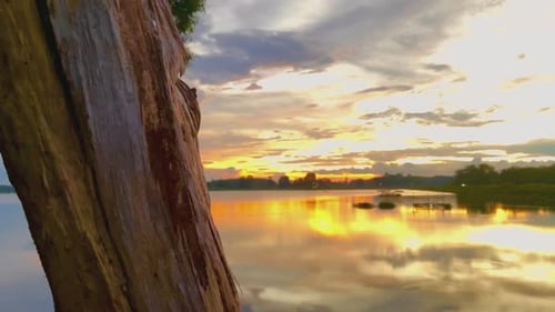 Beautiful sunset over the calm lake water