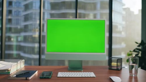 Office Computer with Green Screen in a City Office