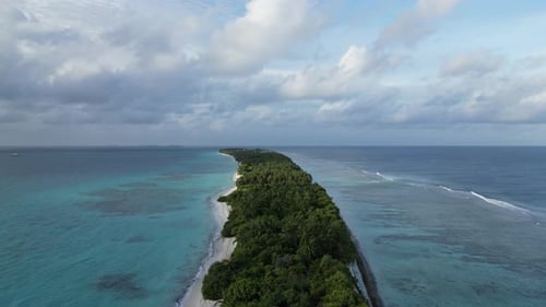 Lush long sandbar amid Indian Ocean in Dhigurah, Maldives, Aerial
