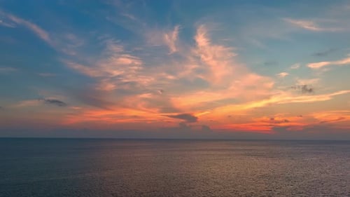 Drone aerial view of endless horizon over the sea in sunset. 4K.