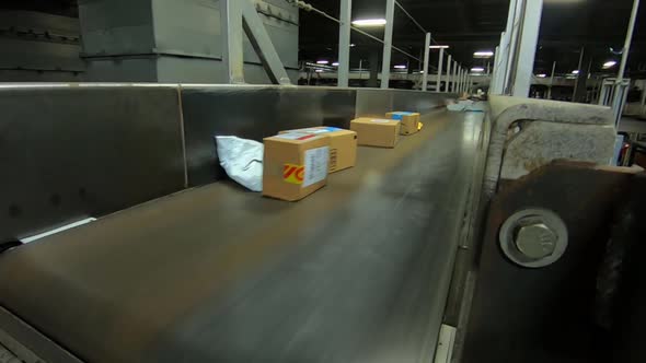 Packages Going On Conveyor Belt In Factory Close Shot Amazon/UPS/FedEX ...