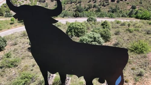 Aerial view of the Spanish national symbol El Toro de Osborne, a huge metal bull on the top of a hil