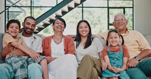 Extended Family Together Smiling in Living Room