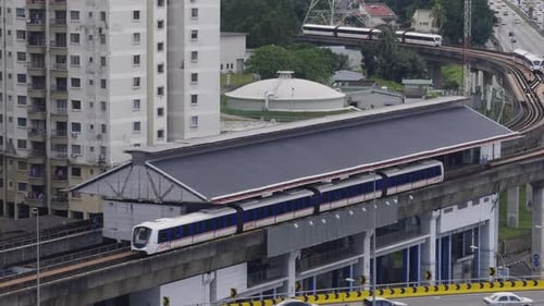Light Rail Transit (LRT) passing through the station, Malaysia