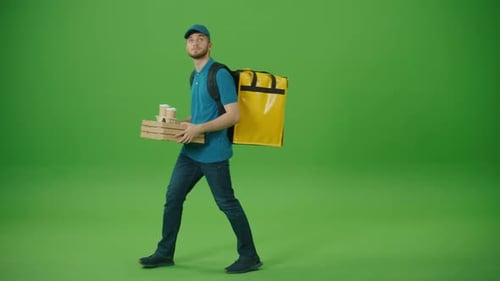 Green Screen Delivery Man in Yellow Uniform With Thermal Backpack Brings Pizza