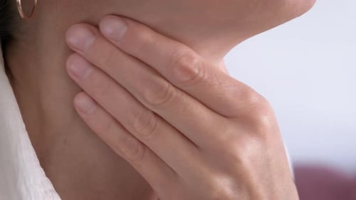 Woman Gently Touching Neck, Self Examination Concept