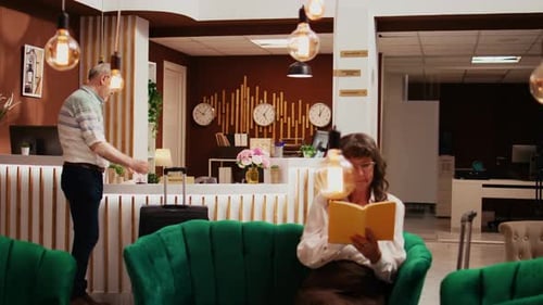 Hotel Lobby Scene with Guest Reading a Book