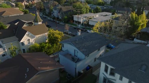 High Angle View of Residential Houses Along Streets in City Tilt Up Reveal of Skyline with Downtown