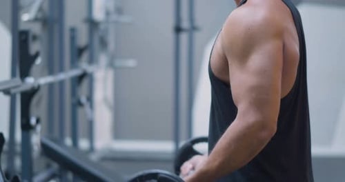 Gym Workout Bicep Exercise Middle Aged Caucasian Man Trains His Bicep Muscles in the Gym