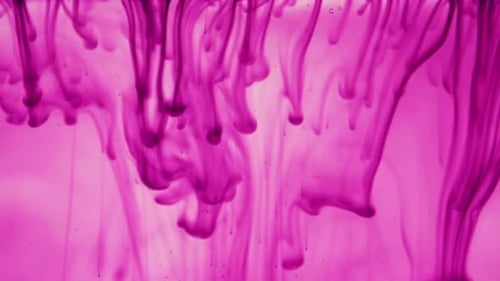 Abstract Pink Ink Spreading Through Water