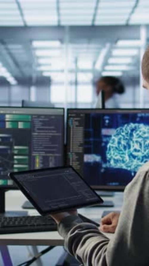 Technician Inspects Rackmounts in Server Room Using Artificial Intelligence Tech