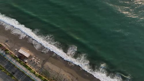 Dramatic Color of the Sea Waves Crashing Against the Rocks Aerial View on a Wild Beach