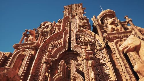 A Towering Building Adorned with Intricate Statues on Its Walls