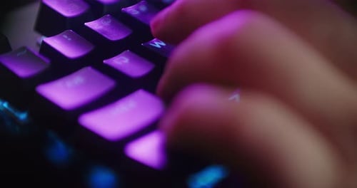 Close Up Hands Shot Showing a Gamer Pushing the Keyboard Buttons while Playing an Online Shooter Vid
