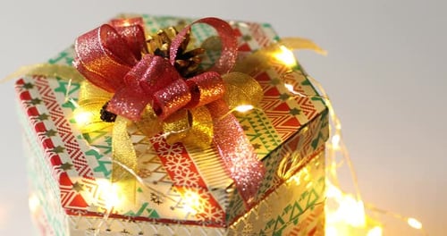Festive Gift Box with Ribbons and Lights