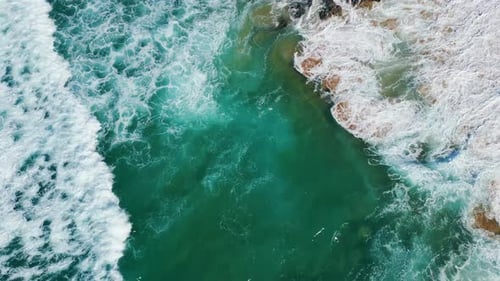 Drone View Powerful Sea Waves Rolling on Beautiful Sandy Beach with Volcanic